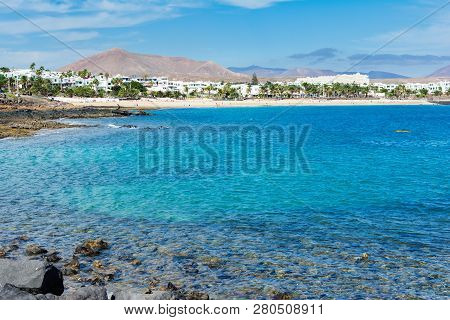 View Of Playa De Las Cucharas Beach In Costa Teguise, Lanzarote, Spain, Turquoise Waters, Selective 