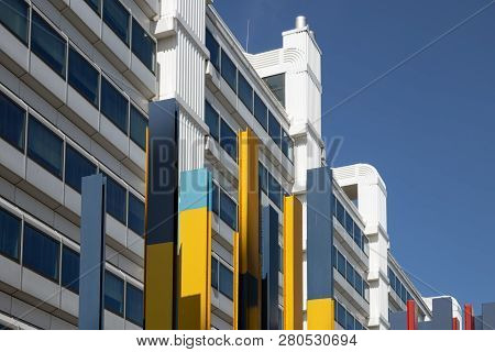Lelystad, The Netherlands - April 18, 2018: Facade Big White Office Building With Work Of Art In The