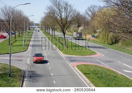 Lelystad, The Netherlands - April 18, 2018: Major Road In Early Springtime Along Park In Lelystad, C