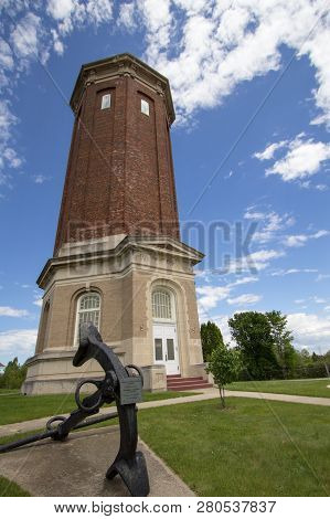 Historic Water Tower. The Historic Brick Water Tower  In Manistique Michigan, Now Serves As The Scho
