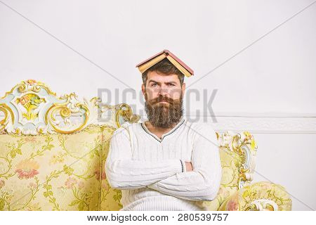 Macho Sits With Open Book On Head, Like Roof. Guy, Teacher Overdid With Teaching, Became Crazy Profe