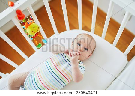 Baby Girl In Co-sleeper Crib