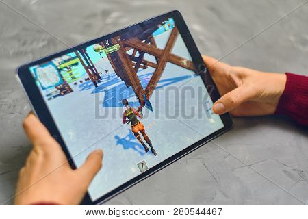 Bishkek, Kyrgyzstan - January 21, 2019: Woman Playing Fortnite Game Of Epic Games Company On Apple I