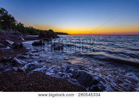 Lake Superior Twilight Beach. Beautiful Sunset Colors On A Remote Rocky Beach On The Coast Of Lake S