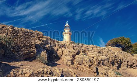 Ancient Ruins Of Kourion City Near Pathos And Limassol, Cyprus. Lighthouse Under The Blue Sky. Trave