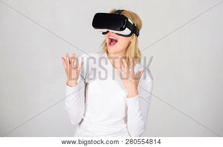 Woman With Virtual Reality Headset. Young Woman Using A Virtual Reality Headset With Conceptual Netw