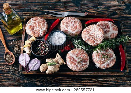 Meat Patties - Raw Swiss Atriaux Of Ground Pork Wrapped In Caul Fat, Sort Of Sausage On A Wooden Tra