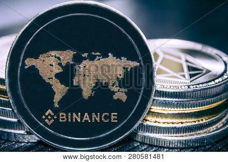 Coin Cryptocurrency Binance On The Background Of A Stack Of Coins. Bnb.