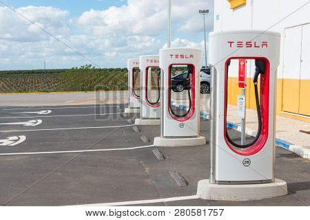 Aguadulce, Seville, Spain - April 29, 2018: A Tesla Electric Supercharger Stand At A Gas Station In 