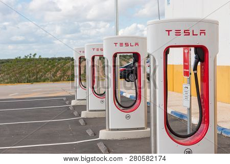 Aguadulce, Seville, Spain - April 29, 2018: A Tesla Electric Supercharger Stand At A Gas Station In 