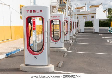 Aguadulce, Seville, Spain - April 29, 2018: A Tesla Electric Supercharger Stand At A Gas Station In 