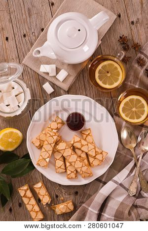 Puff Pastry Cookies With Jam On White Dish.
