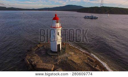 White Lighthouse With Red Roof On Tokarev Cat. Vladivostok, Russia