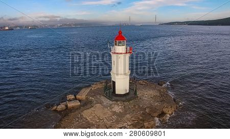 White Lighthouse With Red Roof On Tokarev Cat. Vladivostok, Russia