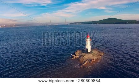 White Lighthouse With Red Roof On Tokarev Cat. Vladivostok, Russia