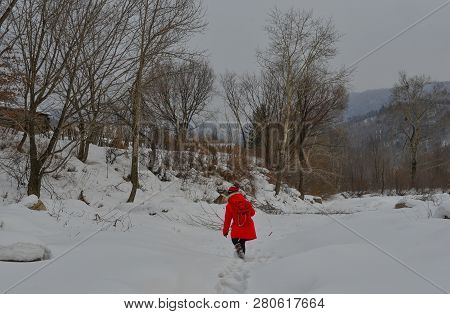Woman Walking At Snow Village In China
