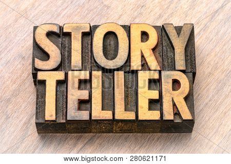 storyteller - word abstract in vintage letterpress wood type against grained wooden background