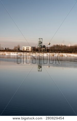 Headframe Od Dul Darkov Bituminous Coal Mine Reflecting On Water Fround Of Karvinske More Lake Near 
