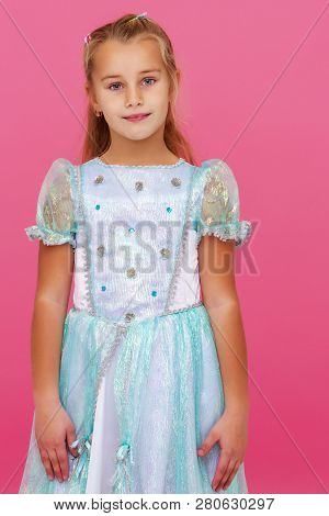 Beautiful Little Girl On A Pink Background. Concepts Style And Fashion, Happy Childhood.