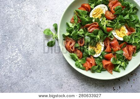 Green Salad With Salted Salmon, Tomato And Boiled Eggs.top View With Copy Space.
