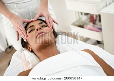 Woman Receiving Head Massage In Spa Wellness Center.