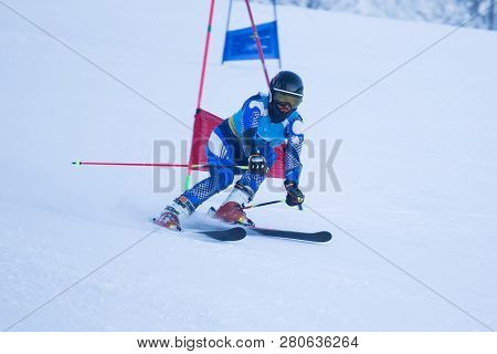 Athlete Engaged In The Race Of Super G , Giant Slalom Downhill Alpine Ski Racer Professional