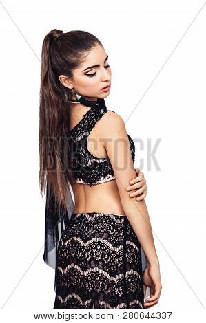 Graceful Young Girl Bellydancer With Oriental Make-up Posing In A Costume Of Raqs Sharqi. Isolated O