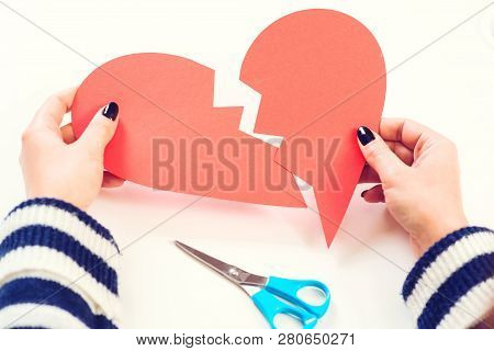 Broken Heart In Woman Hands. Divorce Concept. Unrequited Love. Unhappy Valentine Day. Woman With Bro