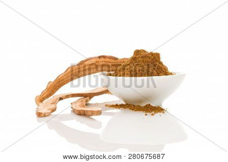 Dry Reishi Medical Mushroom Powder In Bowl Isolated On White Background. Superfood.