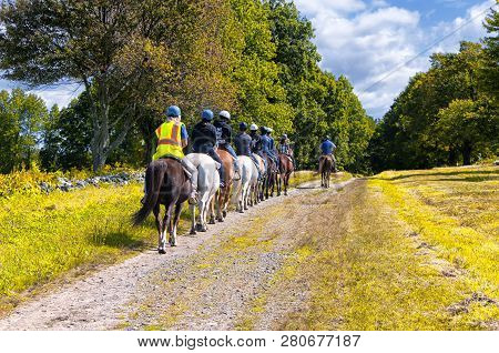 Litchfield, Connecticut.  September 9, 2017. A Group Of Teenagers Riding Horses Within Topsmead Stat