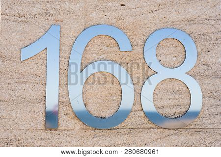 Metal House Number One Hundred And Sixty Eight.