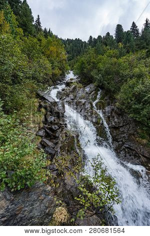 Mountain River And Trees Landscape. Kaunertaler Gletscher Natural Environment. Hiking In The Alps, K