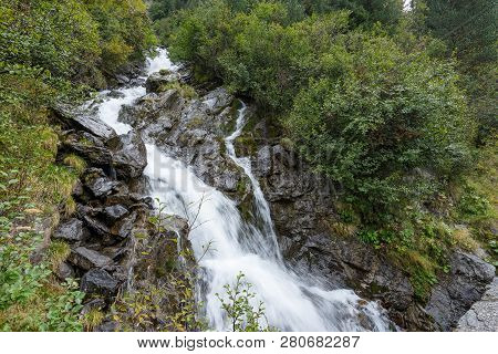 Mountain River And Trees Landscape. Kaunertaler Gletscher Natural Environment. Hiking In The Alps, K