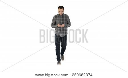 Young Man Walking And Using A Phone, Messaging On White Background.