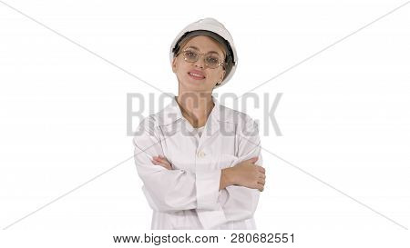 Professional Woman In Lab Coat And White Hardhat Walking And Smiling On White Background.