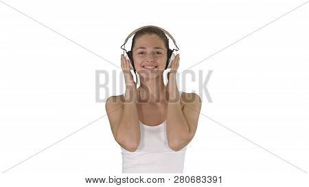 Woman With Headphones Listening Music And Making Funny Face On White Background.