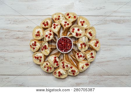 Pomegranate Qatayef Asafiri, Arabian Pancake Stuffed With Sweet Cheese.