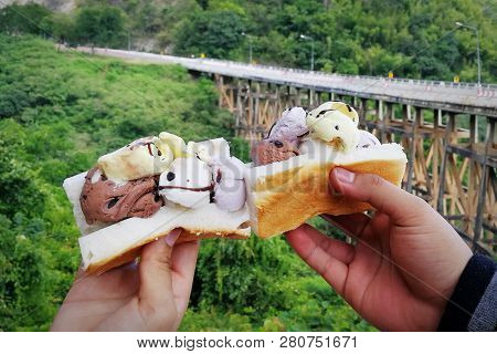 Ice Cream On Bread In Hand And Bridge Road Between Travel In Holiday
