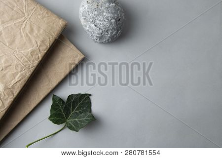 Flat Lay Of Notebok With Stone And Green Leave. Stil Life. Business And Education. Work Table. Minim