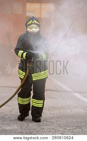 Vicenza, Vi, Italy - May 10, 2018: Italian Fireman Uses The Hydrant With Foam During  An Exercise In