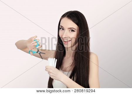 Stop Smoking. Quit Smoking Womens Hands Holding A Bunch Of Cigarettes And Cut Them In Half Scissors.