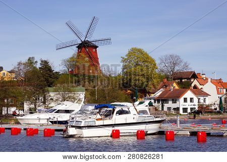 Strangnas, Sweden - May 9, 2018: The Harbor And Windmill Landmark In The City Of Strangnas.