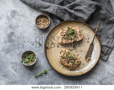 Two Toasts Duck With Prunes Rillettes Pate On White Bread With Sprouts And Various Seeds On A Vintag