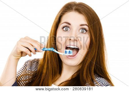 Woman Wearing Dressing Gown Holding Toothbrush With Paste On It. Smiling Positive Girl Ready To Clea