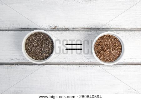 Small Bowl With Chia Seeds And Flax Seeds With Equal Sign Seen Directly From Above On Grey Backgroun