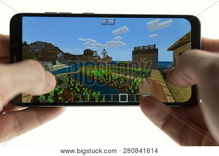Sochi, Russia-january 27, 2018: A Man Is Playing In Minecraft Game On Smartphone