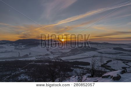 Sunrise On Boren Hill Near Bilina Town In Winter Frosty Color Morning