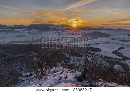 Sunrise On Boren Hill Near Bilina Town In Winter Frosty Color Morning