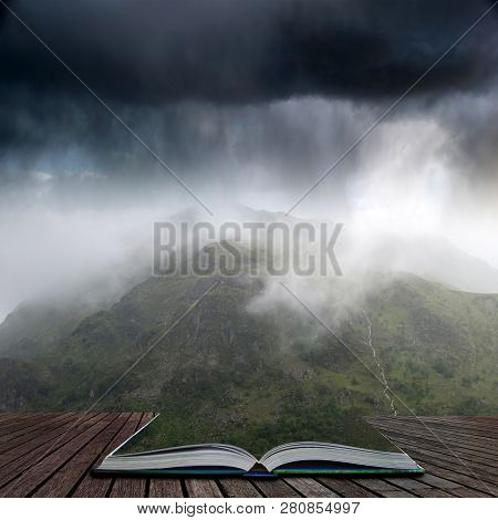 Landscape Image Of Low Cloud Hanging Over Snowdonia Mountain Range After Heavy Rainfall In Autumn Wi