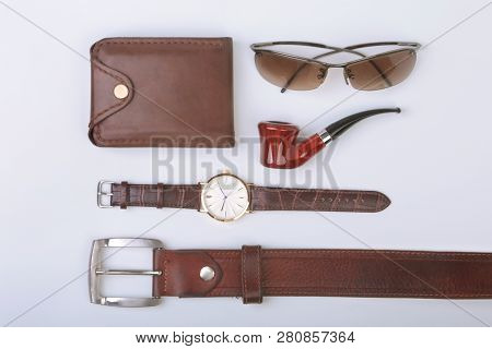 Mens Accessories For Business And Rekreation. Leather Belt, Wallet, Watch And Smoking Pipe On White 